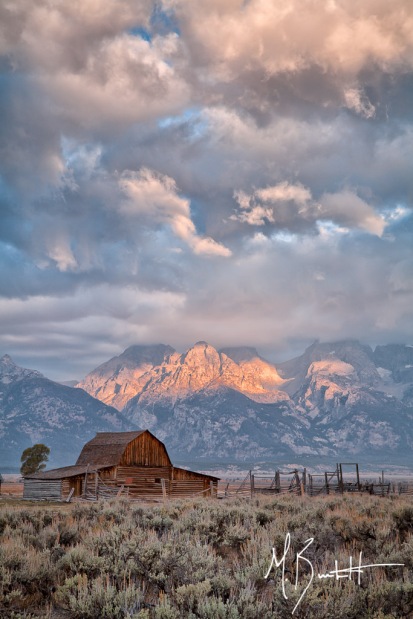 The iconic Mormon Row in Grand Teton National Parks has been photographed probably more than I could ever count, but it's iconic for a reason. I patiently waited for the sun to rise to the east, but the clouds weren't willing to play. That is, until for a few minutes when light peaked though a few holes in the clouds resulting in this pattern of pink light on the Tetons and clouds.