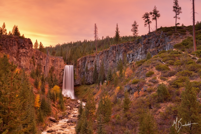 I made it a point to return to Tumalo Falls near Bend to capture the fall colors that surround the canyon walls. In good years the colors are spectacular. Unfortunately I was disappointed in this year's fall colors, but noted light cloud cover hanging over the falls and decided to stay put. The result was more than I expect with a sunset glow of pink, orange, and yellow painting the sky.